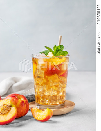 Refreshing peach iced mint tea. The concept of a healthy homemade cold summer drink 119858363