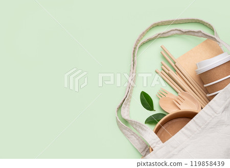 Set of eco-friendly disposable tableware in textile reusable bag with wooden cutlery Set of eco-friendly disposable tableware in textile reusable bag with wooden cutlery 119858439