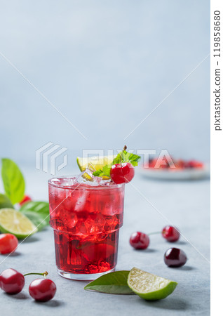 Cherry-lime mojito cocktail with mint, lime and ice on a light background with fresh berries. Cherry-lime mojito cocktail with mint, lime and ice on a light background with fresh berries. 119858680