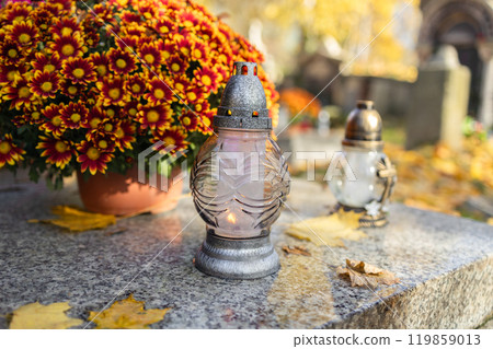 Decorated graves at a cemetery on All Saints Day (Wszystkich Swietych) in Poland. 119859013