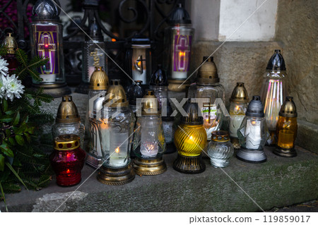 Decorated graves at a cemetery on All Saints Day (Wszystkich Swietych) in Poland. 119859017