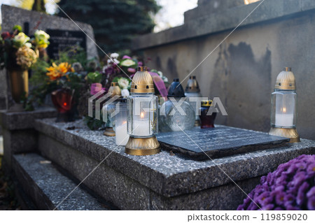 Decorated graves at a cemetery on All Saints Day (Wszystkich Swietych) in Poland. 119859020