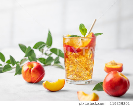 Refreshing peach iced mint tea. The concept of a healthy homemade cold summer drink Refreshing peach iced mint tea. The concept of a healthy homemade cold summer drink 119859201