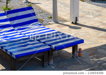 Modern patio next to swimming pool 119859306