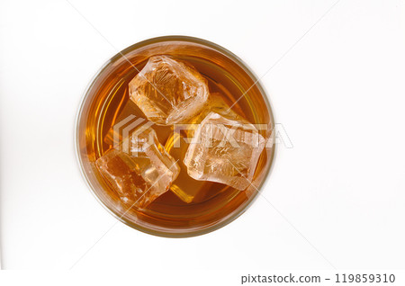 A glass of whisky with ice cubes (top view) 119859310