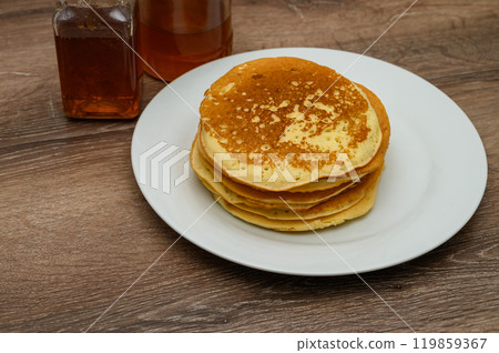 Homemade pancakes on wooden table 119859367