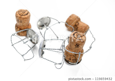 Lots of champagne wine corks on a white background Lots of champagne wine corks on a white background 119859432