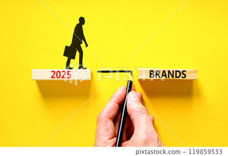Planning 2025 brands new year symbol. Concept words 2025 Brands on beautiful wooden blocks. Beautiful yellow background. Businessman hand. Business 2025 brands new year concept. Copy space. 119859533