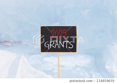 Planning 2025 grants new year symbol. Concept words 2025 Grants on beautiful yellow chalk blackboard. Beautiful Baikal lake blue ice background. Business 2025 grants new year concept. Copy space. 119859639