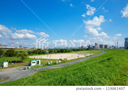 Arakawa riverbed ground and white clouds in the blue sky, Ogi Ohashi Bridge and Nippori Toneri Liner 119861407