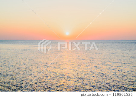 Beautiful sunset with orange sky on the beach of Menorca, Balearic Islands. Sunset, nature Beautiful sunset with orange sky on the beach of Menorca, Balearic Islands. Sunset, nature 119861525