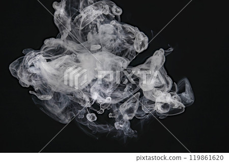 Smoke or steam blowing in the wind on a black background 119861620