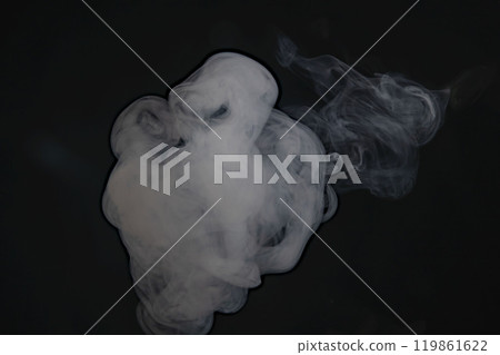 Smoke or steam blowing in the wind on a black background Smoke or steam blowing in the wind on a black background 119861622