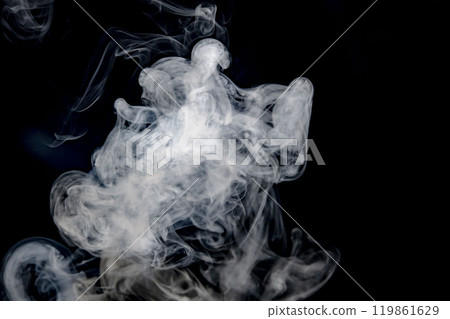 Smoke or steam blowing in the wind on a black background 119861629