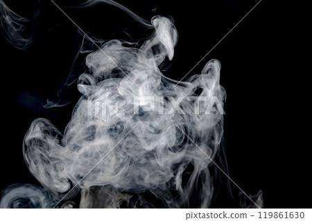 Smoke or steam blowing in the wind on a black background Smoke or steam blowing in the wind on a black background 119861630