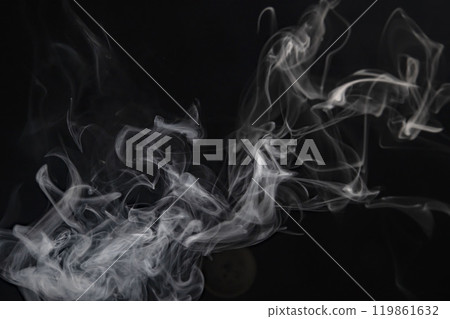 Smoke or steam blowing in the wind on a black background Smoke or steam blowing in the wind on a black background 119861632
