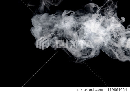 Smoke or steam blowing in the wind on a black background 119861634