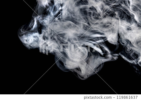 Smoke or steam blowing in the wind on a black background 119861637