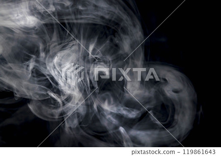 Smoke or steam blowing in the wind on a black background Smoke or steam blowing in the wind on a black background 119861643