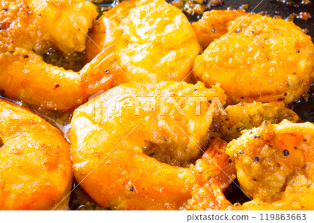 Garlic shrimp cooking in a frying pan 119863663