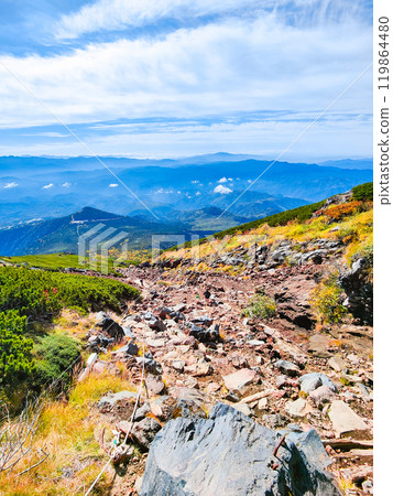 Climbing Mt. Ontake in autumn: View from the hiking trail (from the 8th station stone refuge hut to the summit of Otaki) 119864480