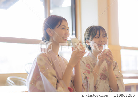 Young women relaxing after a bath 119865299