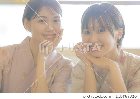 Young women relaxing after a bath Young women relaxing after a bath 119865320