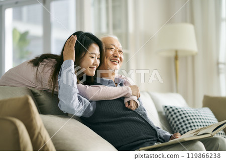 asian elderly father and adult daughter having a good time asian elderly father and adult daughter having a good time 119866238