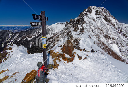 View of the Northern Alps and Mt. Yokodake and Mt. Iodake in the harsh winter from the top of Jizo Ridge 119866691