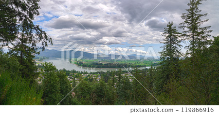 View of the Mission town with Fraser River, lush green valley and the mountains in the background - Fraser Valley, BC, Canada 119866916