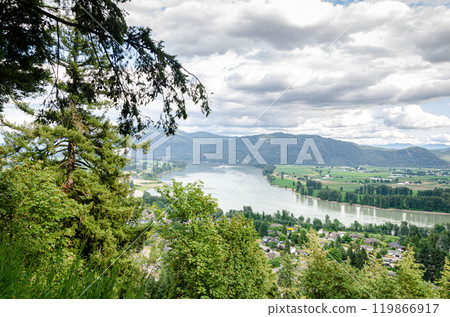 View of the Mission town with Fraser River, lush green valley and the mountains in the background - Fraser Valley, BC, Canada 119866917
