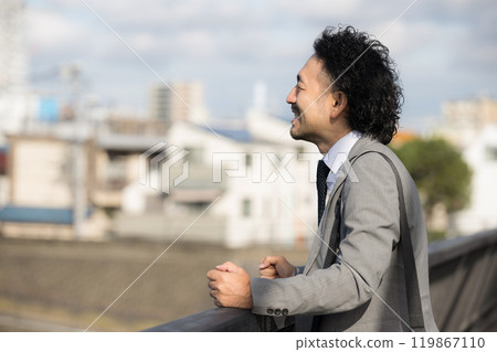 Profile of a middle-aged man screaming towards the sunset Midlife Crisis 119867110