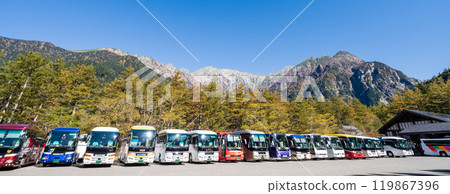 Buses lined up at the bus terminal in front of Kamikochi Tourist Center in Nagano Prefecture 119867396