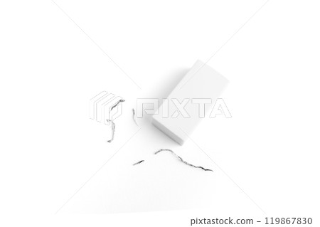 White eraser on a white surface with a few eraser shavings scattered around, emphasizing simplicity and cleanliness. 119867830