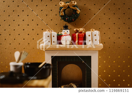 Christmas fireplace with presents, snowman and wreath decorations 119869151