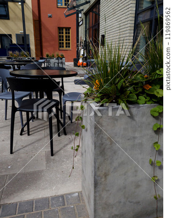 Street cafe in city with plants outdoor. 119869562