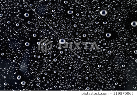 Drops of water on a black surface. The condensate. Top view. Free space. Drops of water on a black surface. The condensate. Top view. Free space. 119870065