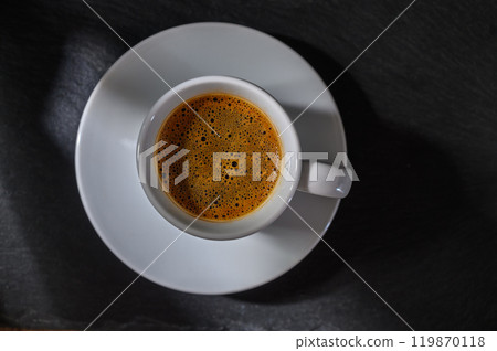 cup of Turkish coffee with foam on a dark background 119870118