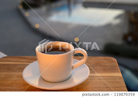a cup of black Turkish coffee on the balcony at sunset 119870359