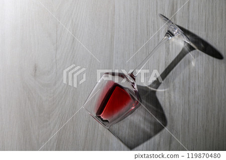 Red wine in laying glass on white background 119870480