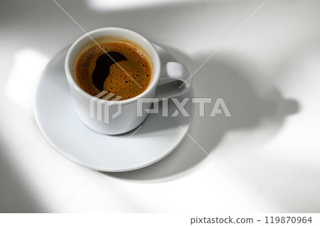 Cup of black coffee white background. Hot coffee in a cup. Cup of black coffee white background. Hot coffee in a cup. 119870964