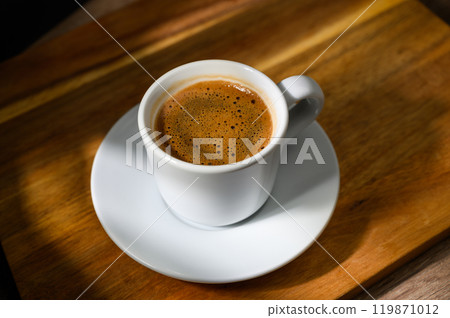 Food background with cup of coffee on wooden table 119871012