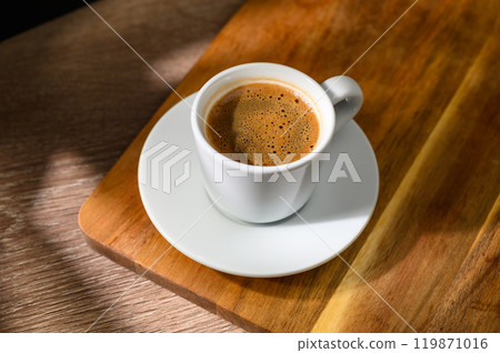 Traditional Turkish coffee cup placed on a wooden table Traditional Turkish coffee cup placed on a wooden table 119871016
