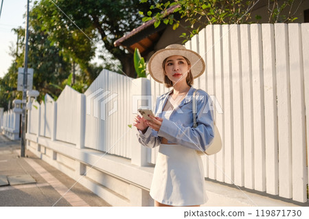 A woman wearing a straw hat 119871730