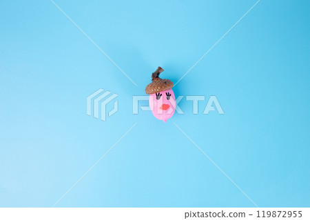 small pink acorn with red lips on blue small pink acorn with red lips on blue 119872955