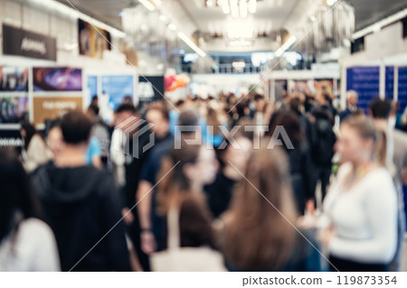 Abstract blurred people at exhibition hall of expo event trade show. Business convention show or job fair. Business concept background. Abstract blurred people at exhibition hall of expo event trade show. Business convention show or job fair. Business concept background. 119873354