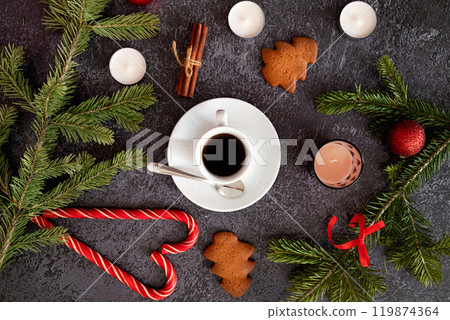 Christmas brown background with fir tree and decoration on dark wooden board. Christmas wallpaper. Christmas, New Year's composition with copy space for text. Flat lay, top view 119874364