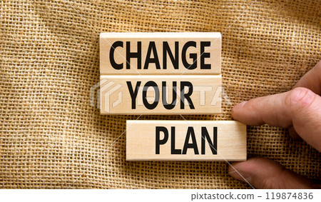 Change your plan symbol. Concept words Change your plan on wooden blocks on a beautiful canvas table canvas background. Businessman hand. Business, finacial and change your plan concept. Copy space. Change your plan symbol. Concept words Change your plan on wooden blocks on a beautiful canvas table canvas background. Businessman hand. Business, finacial and change your plan concept. Copy space. 119874836