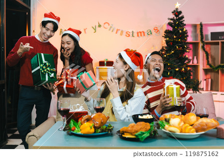 Dinner and group of people celebrating together at Merry Christmas and Happy New Year. Dinner and group of people celebrating together at Merry Christmas and Happy New Year. 119875162