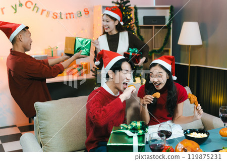 Dinner and group of people celebrating together at Merry Christmas and Happy New Year. Dinner and group of people celebrating together at Merry Christmas and Happy New Year. 119875231